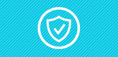 Circular white icon of a check mark on the front of a shield, on a cyan background.

